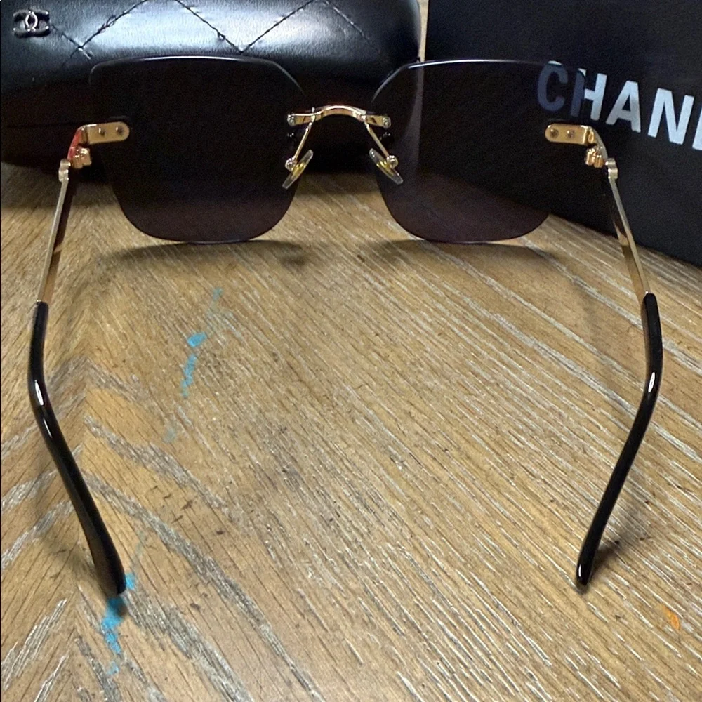CHANEL Rimless Square Sunglasses in Black with Gold Details